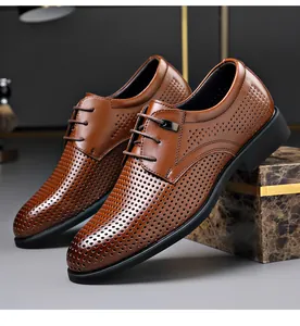 Detailed view of breathable brown perforated leather business dress shoes for men.