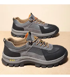 Gedetailleerd zijaanzicht van duurzame grijze en zwarte outdoor wandelschoenen
