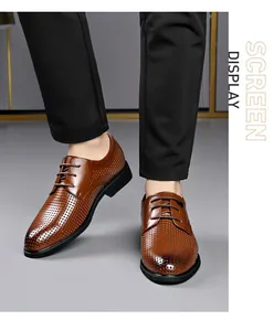 Close-up detail of stylish brown breathable perforated leather business shoes for men