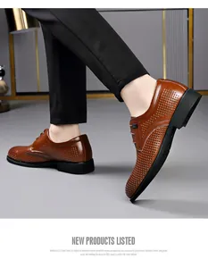 Breathable hollowed brown men's business leather shoes with perforated design.
