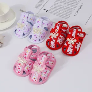 Soft-sole floral baby girl walking sandals with butterfly accents in multiple colors