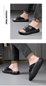Detailed macro view of men's black outdoor breathable slides with adjustable buckle