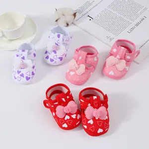 Soft-soled baby sandals with heart patterns and cute bow details in multiple colors.