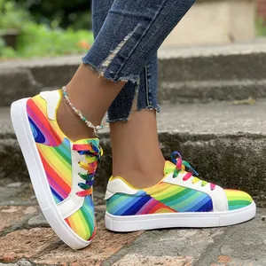Detail shot of vibrant women's rainbow gradient sneakers for a stylish street look