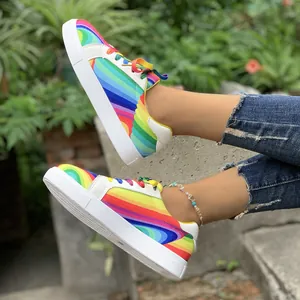 Side view of vibrant rainbow stripe sneakers for women in a street style setting