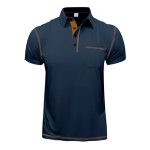 Detailed view of navy blue polo shirt featuring orange contrast stitching and pocket