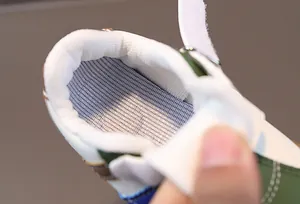 Macro view showing the breathable mesh lining and soft interior of toddler walking shoes