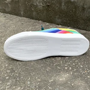 Detailed view showing the white anti-slip sole and rainbow gradient pattern on sneaker