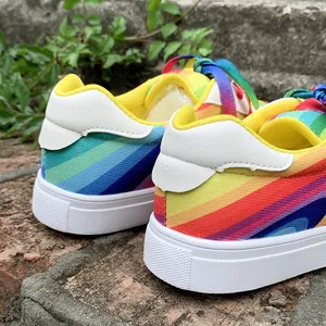 Close-up of rainbow gradient women sneakers showing heel detail and vibrant colors.