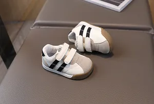 Toddler white PU leather walking shoes with grey suede accents and gum sole