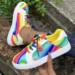 Vibrant rainbow gradient women's casual sneakers with white soles and matching laces