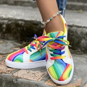 Vibrant rainbow gradient women's canvas sneakers with colorful laces for street fashion