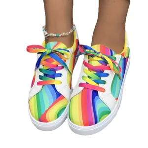 Vibrant rainbow gradient canvas sneakers for women with colorful laces and trendy street style