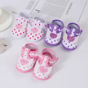 Cute polka dot baby girl sandals featuring winged heart applique and comfortable soft soles