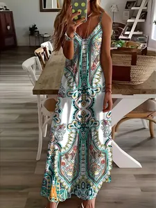 Detailed view of the vibrant vintage floral paisley print on a summer maxi slip dress.