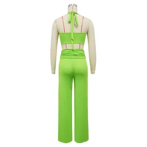 Back view of lime green sexy halter crop top and wide-leg trousers set