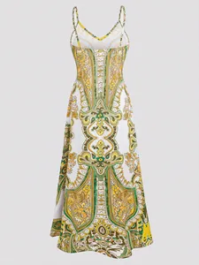 Detailed view of bohemian paisley print maxi dress with intricate yellow floral patterns