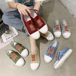Detail view of casual women's platform canvas shoes featuring rainbow elastic bands.