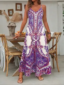 Full-length bohemian maxi dress featuring a vibrant purple vintage paisley print