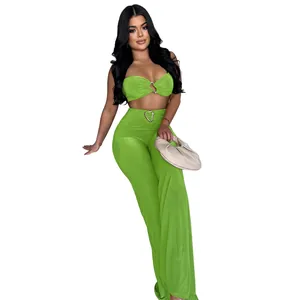 Sexy neon green two-piece set featuring bandeau top and flared trousers with heart buckle
