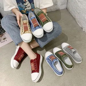 Close-up detail showing the variety of colorful women's canvas shoes with elastic bands