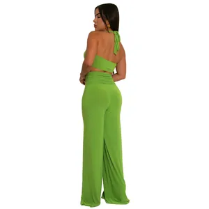 Detailed back view of a vibrant lime green halter neck crop top and wide leg pants set