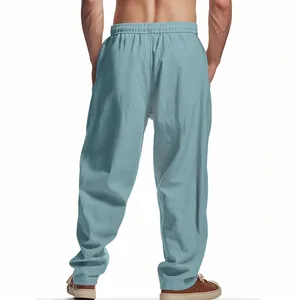 Detailed back view of men's loose light blue linen wide-leg trousers with elastic waist