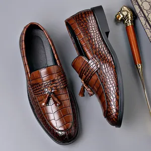 Classic brown men's crocodile embossed leather loafers with tassel detail