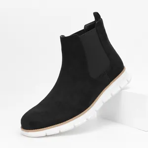 Detailed side view of black suede men's Chelsea boots with a flexible white sole