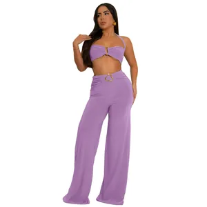 Detail view of purple halter neck top and wide leg pants set on a white background