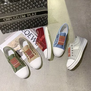 Various colors of women's retro platform canvas sneakers with striped elastic bands.