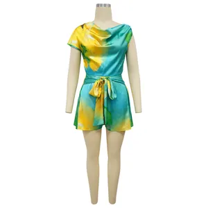 Vibrant floral print sleeveless romper with asymmetric neck and waist tie for fashion women.
