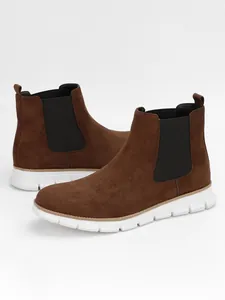 Brown suede Chelsea boots for men with lightweight white outsoles, side angle view.