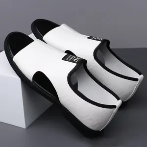 Close-up detail of white men's breathable beach sandals with black trim