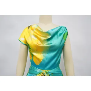 Detailed shot of women's floral print jumpsuit featuring an elegant cowl neck design