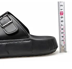 Detail view showing the 5cm thick foam sole height of these men's casual black slides
