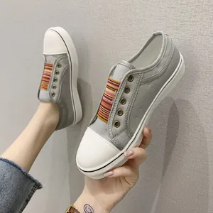 Grey canvas sneakers for women with rainbow elastic bands and thick white soles