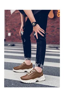 Men's 8cm platform chunky sneakers in brown leather, stylish street photography view