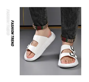 Detailed view of stylish white double-strap buckle foam slides on model for summer
