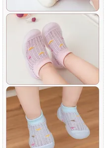 Detailed view of breathable mesh baby walking shoes in pink and blue color options