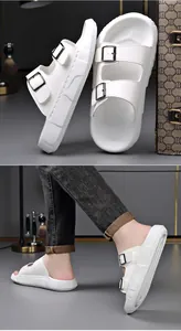 Detailed view of white men's buckle sandals with thick soft soles for summer wear