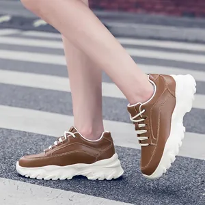 Stylish brown platform sneakers featuring 8cm height increase and thick wavy soles