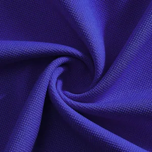 Close-up macro view of blue quick-dry breathable mesh fabric texture for polo shirt