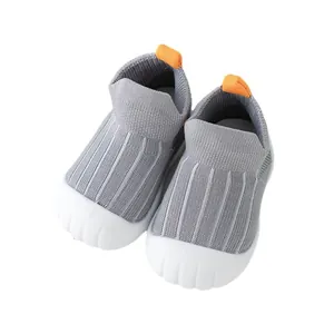 Breathable baby walking shoes with grey knit upper and soft non-slip white sole
