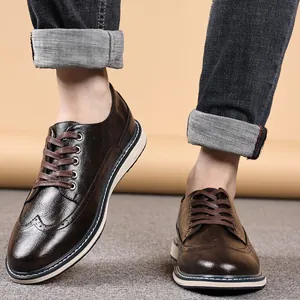 Men's brown wingtip brogue leather shoes, stylish casual footwear for youth, breathable design.