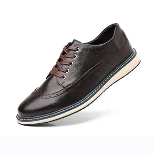 Classic men's brown brogue shoes with decorative wingtip carving and lace-up closure