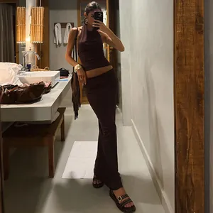 Full-body view of brown halter neck backless top and matching bodycon maxi skirt set