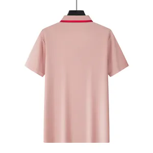 Detailed back view of a pink mesh polo shirt featuring short sleeves and a red collar trim.