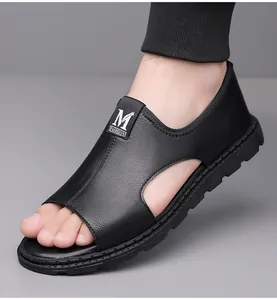 Close-up view of men's black leather Roman sandals featuring a breathable hollow design.