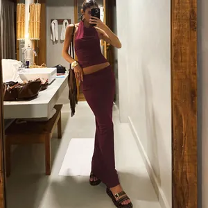 Full-length mirror selfie featuring a sexy burgundy halter neck top and matching long skirt set.